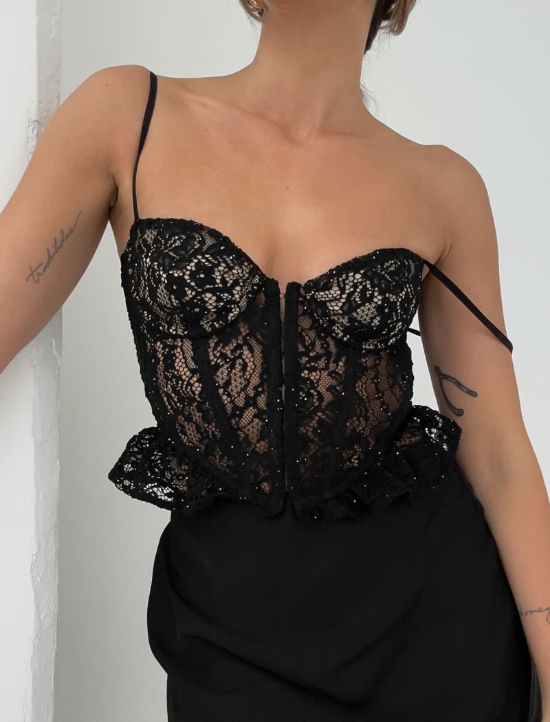 http://www.shoprumored.com/cdn/shop/files/cabaret-corset-black-lace-finalsale-final-sale-bustiers-and-corsets-rumored-trochilidae-piece-garment-295.jpg?v=1706010245